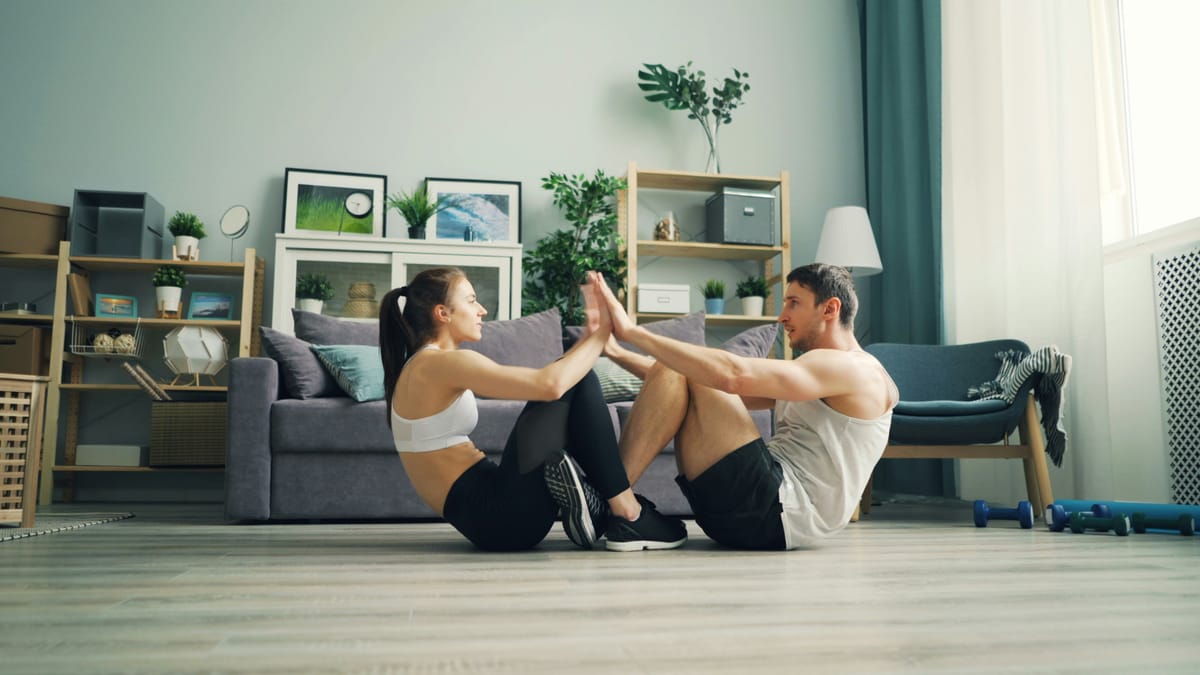 A family doing no-equipment workout at home as part of Step.co fitness program, promoting fun, full-body home exercises for all levels